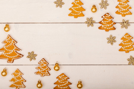 christmas homemade gingerbread cookies on wooden table, top view, copy space