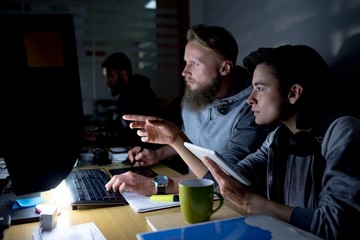 Colleagues working together at desk
