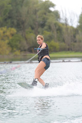 athlete enjoys wakeboarding on the river