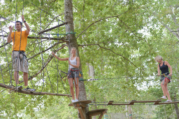 family climbing rope at the adventure park