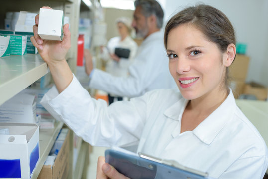 portrait of female pharmacists working in modern farmacy