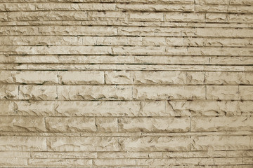 Old beige stone wall background texture