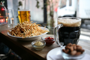 Beers, chips and nuts - Snack time at the pub