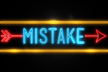 Mistake  - fluorescent Neon Sign on brickwall Front view