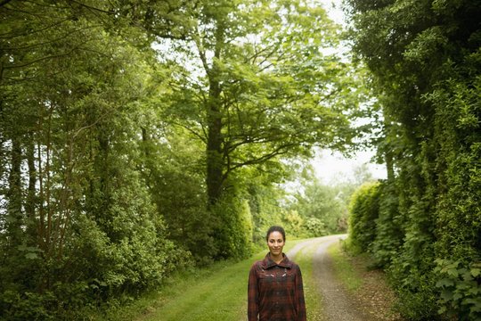 Portrait Of Beautiful Woman Walking In Path