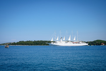 Fototapeta na wymiar Sailboats set sail from Rovinj Croatia