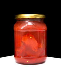 Tomatoes marinated in a glass jar