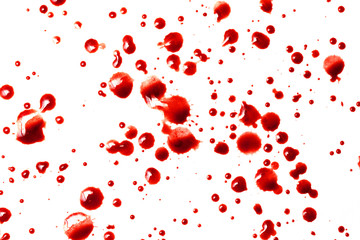 drops of red blood on white paper