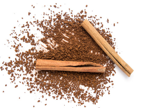 Sticks Of Cinnamon Powder On A White Background