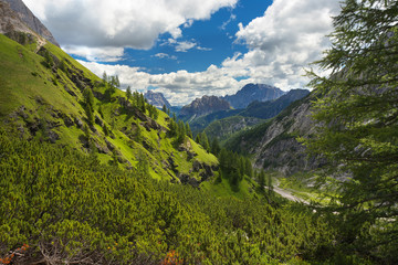 Fototapeta na wymiar Mountain valley with peaks of Monte Civetta and Monte Pelmo, Dolomites, Italy