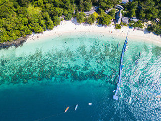 Aerial view or top view of tropical island beach with clear water at Banana beach, Coral Island,...
