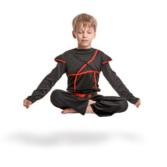 Young ninja meditating © Denys Kurbatov