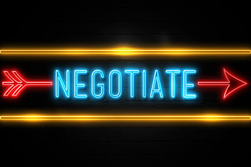 Obraz premium Negotiate - fluorescent Neon Sign on brickwall Front view