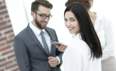 close-up of a beautiful woman manager and co-workers in the office