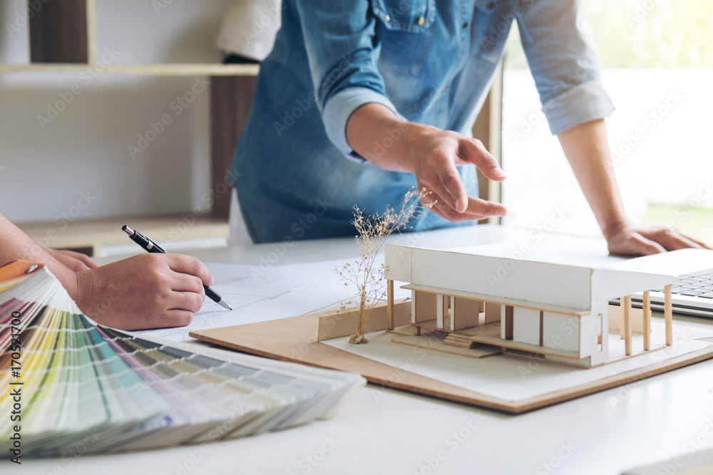 Poster two young women interior design or graphic designer working on project of architecture drawing with 