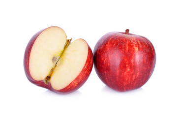 whole and cut ripe apple on white background