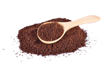 ground coffee arabica strong blend in wooden spoon and on white background