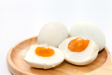 salted egg on wooden plate