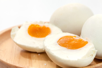 salted egg on wooden plate