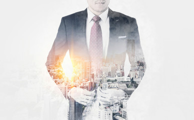 Asia business concept - thoughtful modern office man with dark suit, stand and think the business plan. Double exposure effect with Japan city skyline background. Mix hand drawn sketch illustration