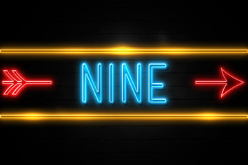 Nine  - fluorescent Neon Sign on brickwall Front view