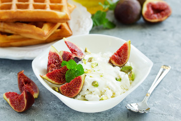useful breakfast, cottage cheese with figs and honey.
