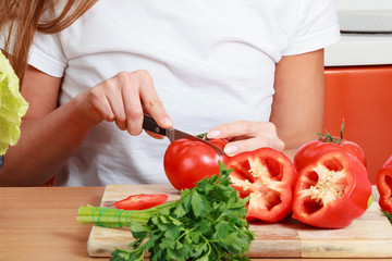 Closeup shot of a woman preparing a salad