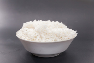 cooked rice on bowl on black background