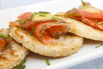 fine dinning, small potato pancakes with salmon slices and dill