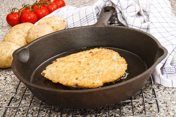freshly baked potato pancake in a pan