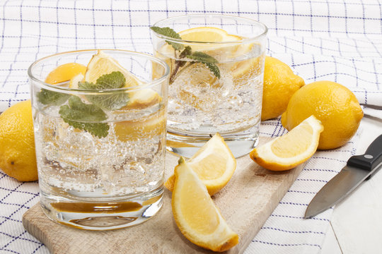 cold mineral water with lemon as a refreshing drink
