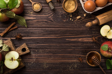  Wooden background with ingredients for baking apple pie