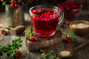 hot lingonberry (or cranberry) tea in glass cup