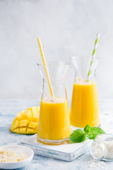fresh mango smoothie with almond and coconut