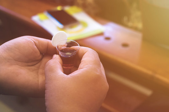 Girl holding bread and wine in a Holy communion.