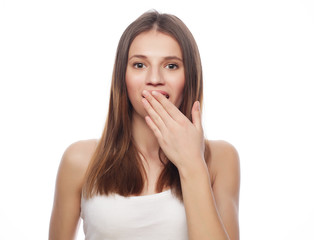 Naklejka premium lifestyle and people concept: Beautiful young surprised woman 