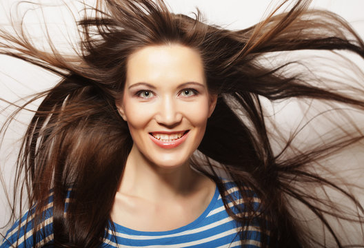 lifestyle and people concept: Beautiful adult woman with wind in