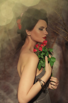 Beautiful Woman With Red Roses. 