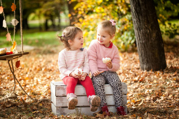 Smiling girls in the autumn park