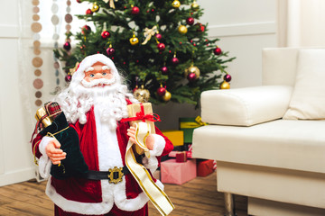 decorative santa with christmas gifts