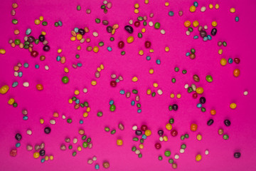 colorful candies on pink table