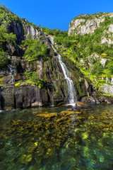 Fototapeta na wymiar Waterfall Trollfjord (Trollfjorden) in the Lofoten Islands, Norway