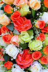 Colorful artificial roses flowers.