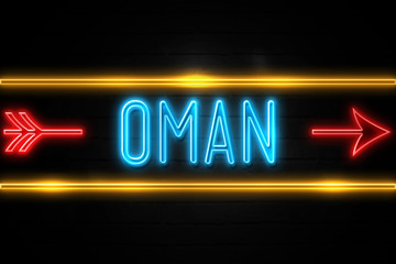 Oman  - fluorescent Neon Sign on brickwall Front view