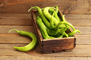 green peppers on wood