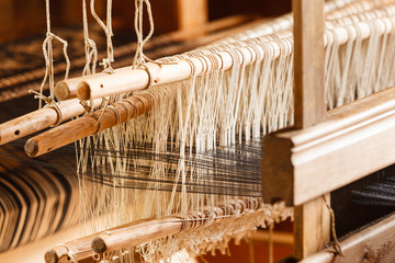 Oldfashioned thread on old spindle, spinning wheel