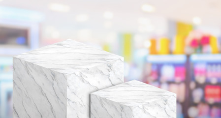 Fototapeta na wymiar Product display stand made from white glossy marble in two step with copy space and blur department store background,for display of product or advertise design on website,3d rendering