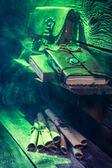 Witcher cottage with green light and books for Halloween