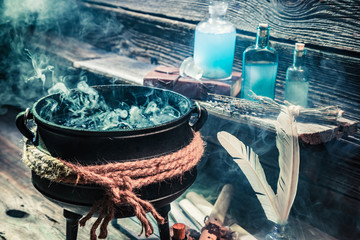 Witch pot with potions and scrolls for Halloween