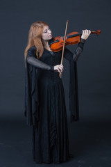 Medieval redhead violin player © CesareFerrari